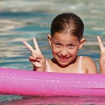 Little Girl Swimming in Pool