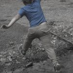 boy jumping creek rocks stream picture