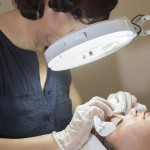 Closeup of Esthetician and skin care professiona