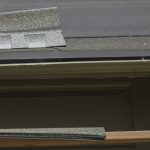 Close up picture of roof tiles and roofer roofing a house stock photography