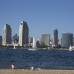 A beautiful day in San Diego beach city skyline kids playing beach